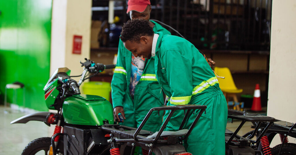 Image of mechanics working on e-motorbike